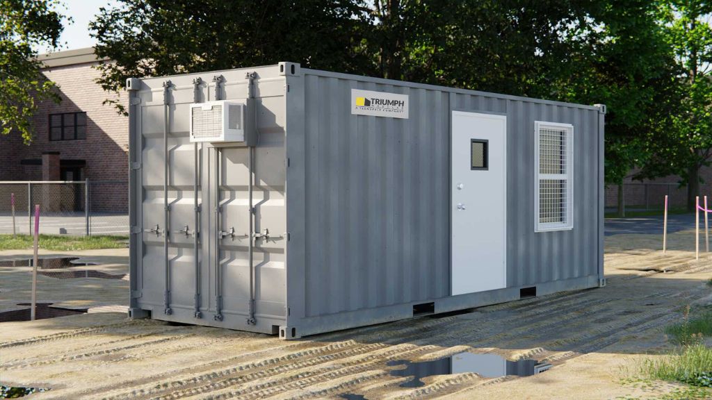 ALT text: Exterior view of a Triumph Modular temporary modular building, showcasing its durable container design and functional door, ideal for modular construction projects.