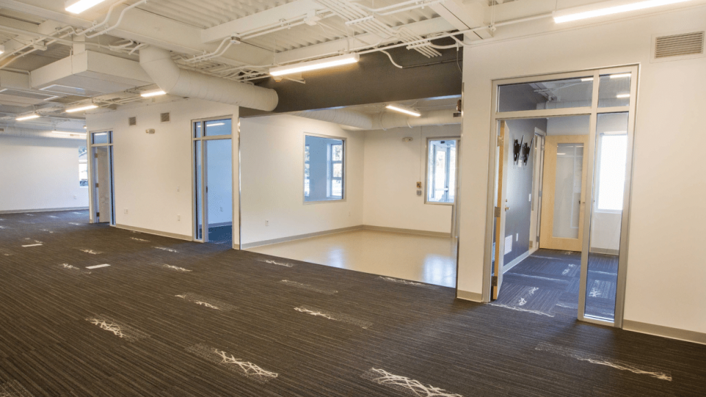 Interior view of a triumph modular building showcasing an open layout suitable for modular construction, featuring natural light and modern design elements.