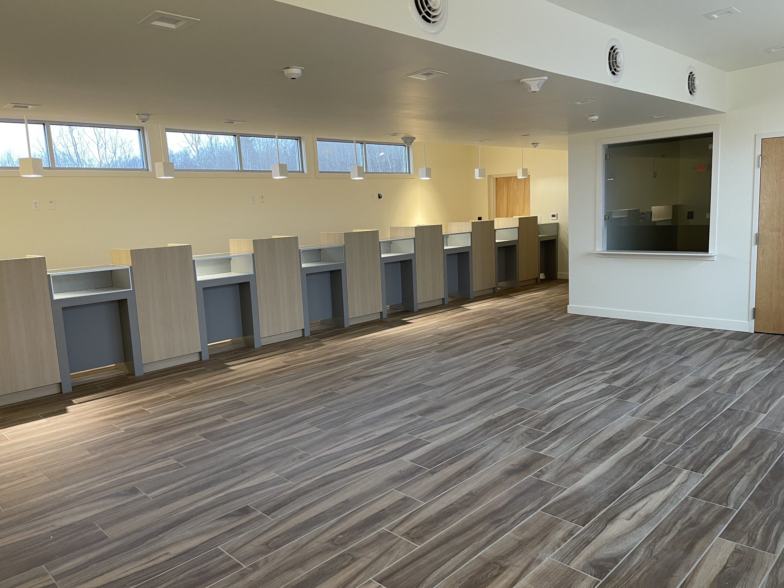 Interior image of stations and display cases in a retail store.