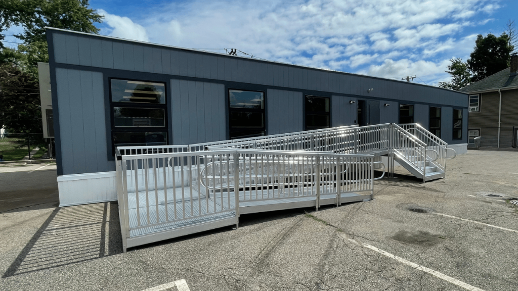 Accessible ramp leading to a triumph modular building, showcasing features of modular construction and its suitability for permanent and temporary modular building solutions.