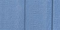 Close-up view of blue textured wall panel, showcasing the finish used in modular building construction.