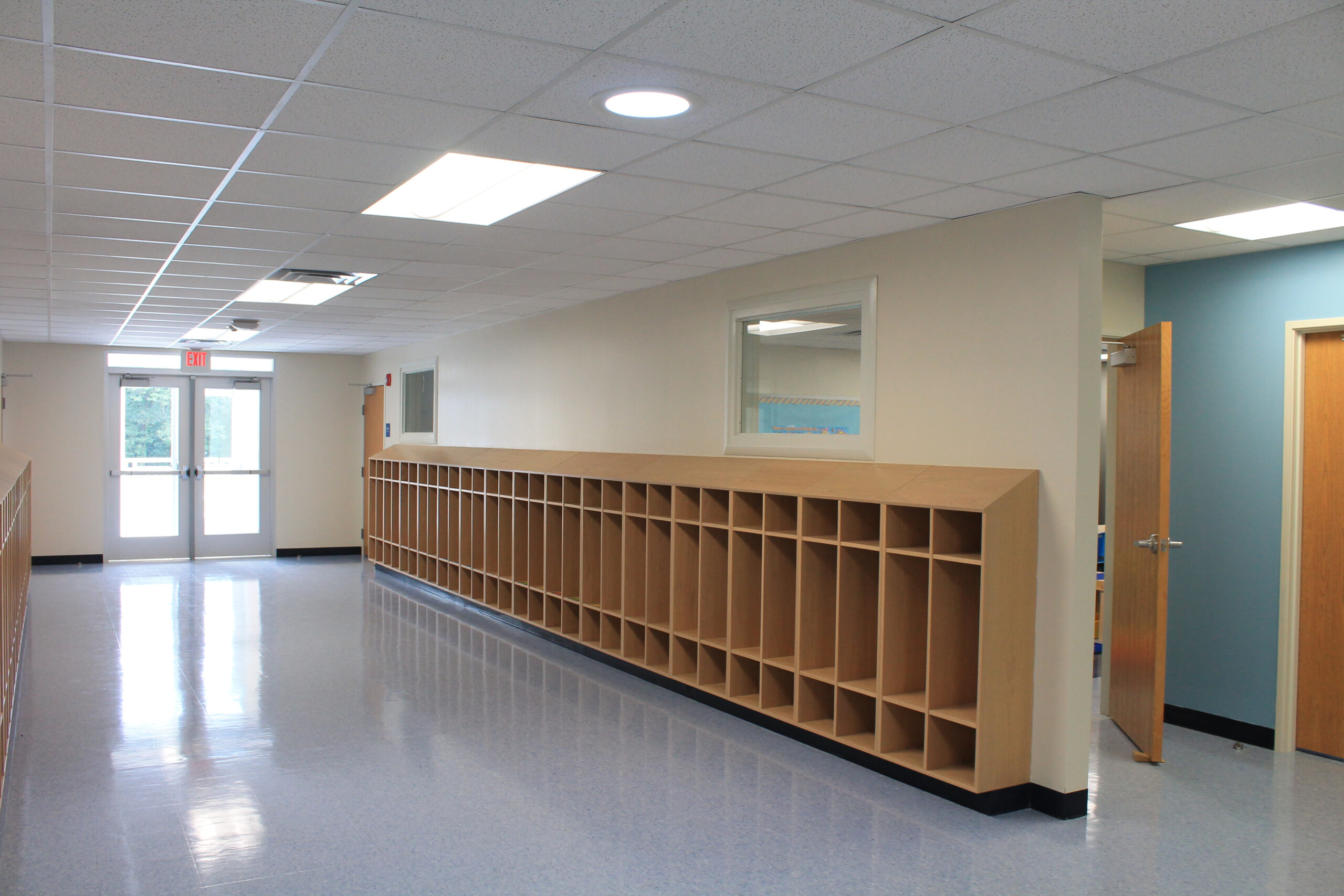 Hallway with cubbies for an modular elementary school.