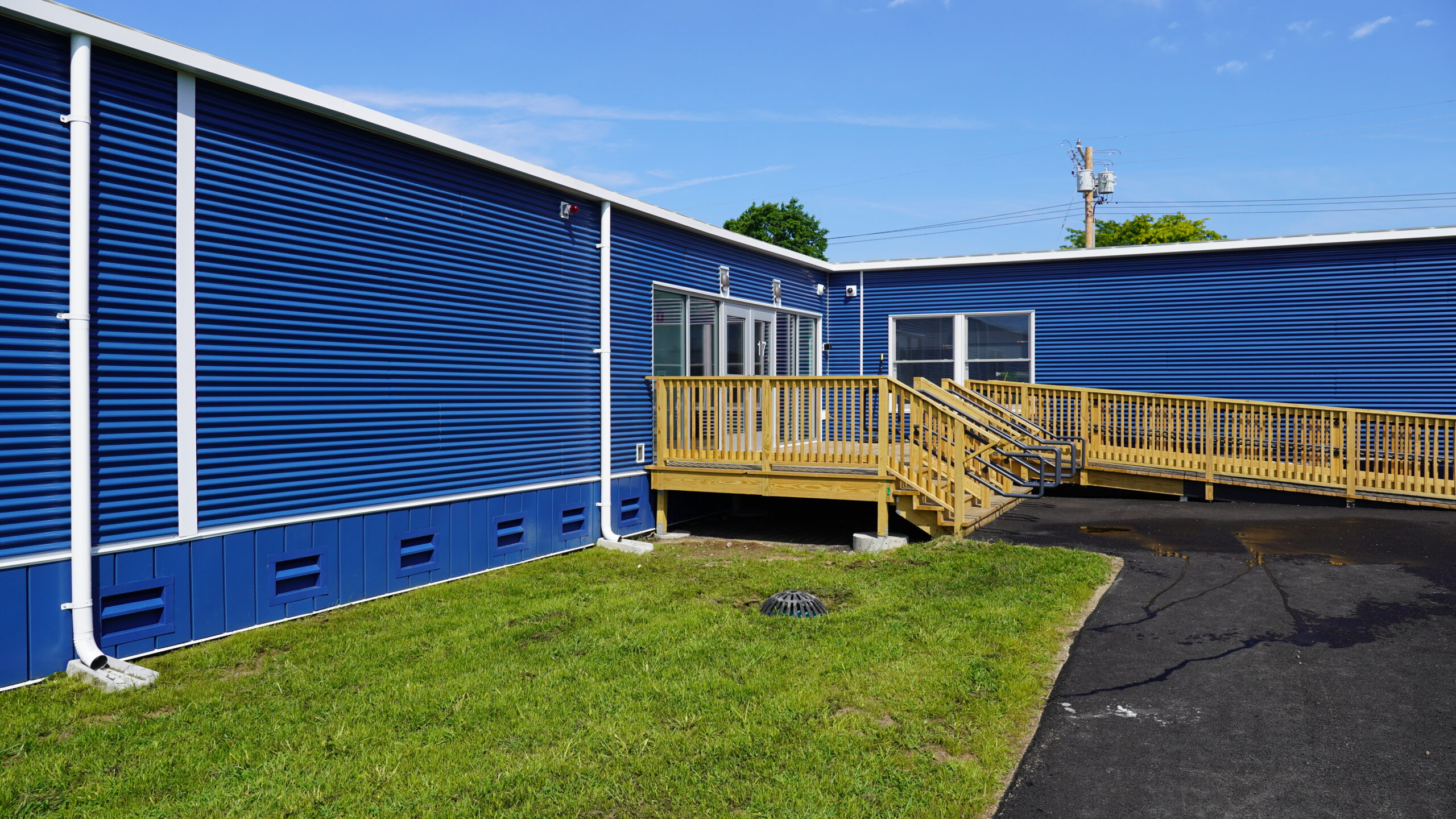 Exterior of classroom addition with wood ramp