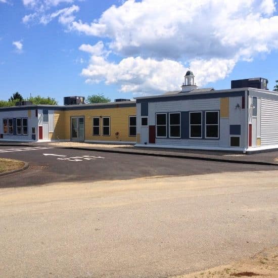 Exterior image of the colorful Enoch Cobb early learning center in Barnstable, MA