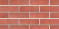 Red brick wall showcasing the durability and aesthetic appeal of modular construction. Ideal for permanent modular building applications.